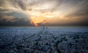 Aerial view of a city skyline at sunset