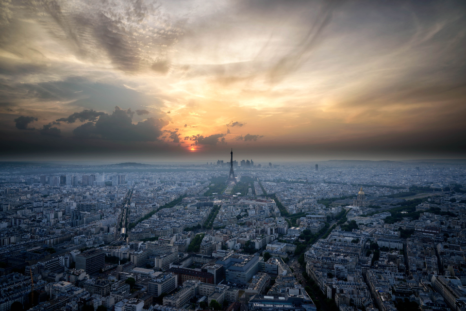 Aerial view of a city skyline at sunset
