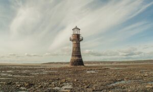 Old abandoned lighthouse rocky coast