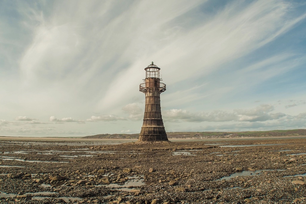 Old abandoned lighthouse rocky coast