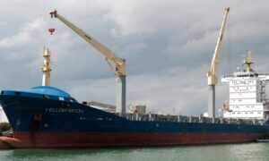 Yellow Moon container ship docked in Auckland harbour